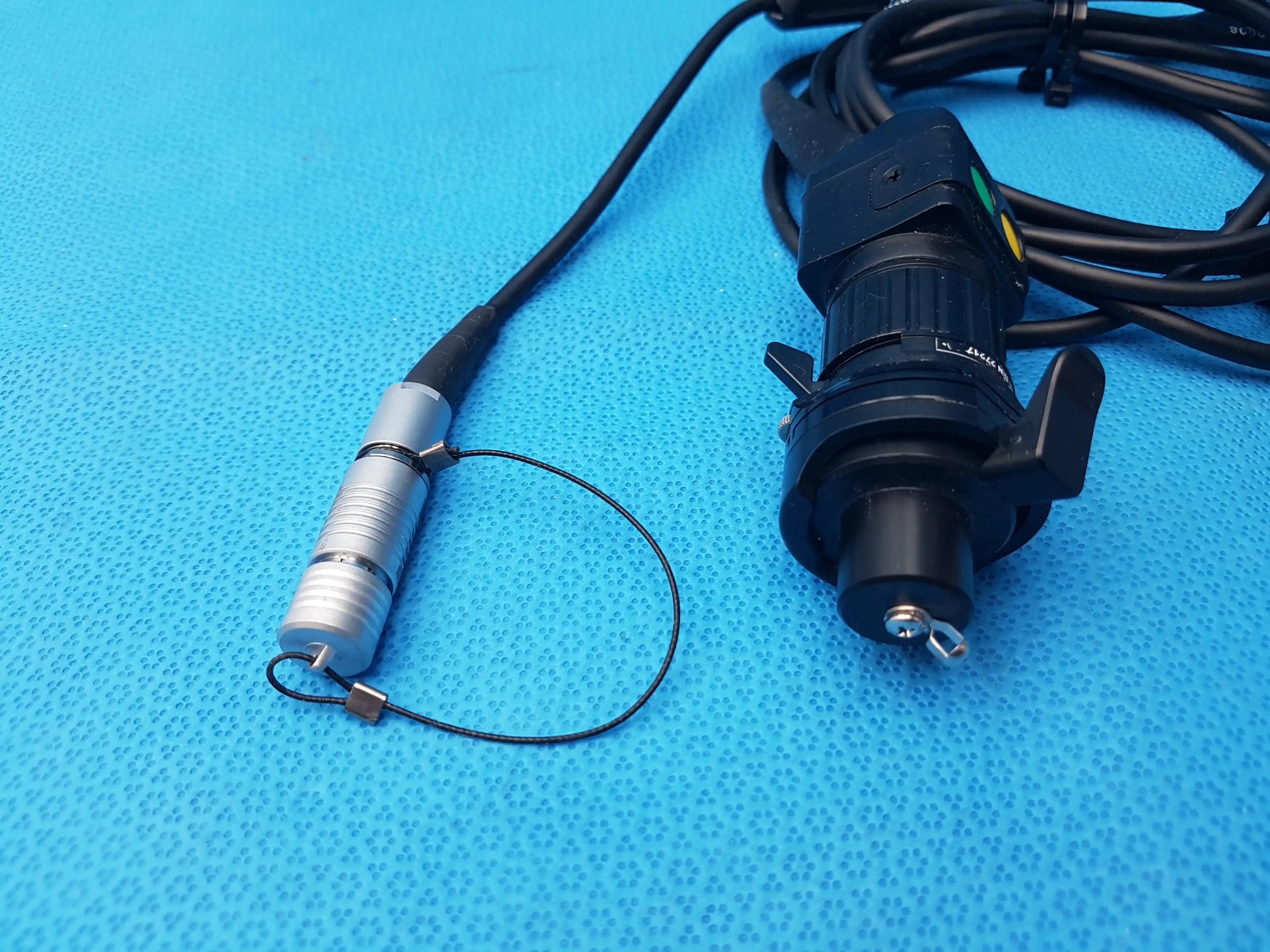 Black and silver h10-0008 ipx7 endoscopic camera head with coiled cable and metallic tip compatible endoscopic device