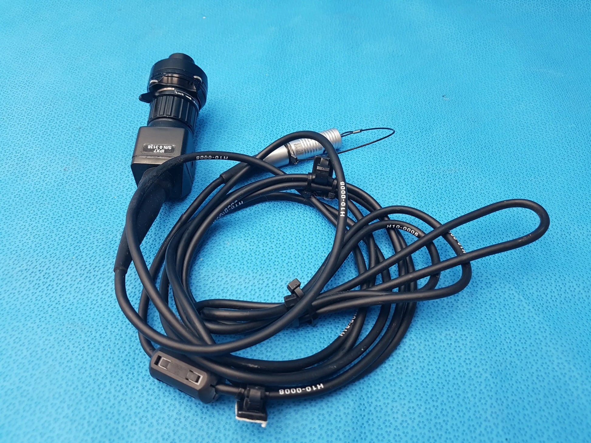 Black h10-0008 ipx7 endoscopic camera head with cable and coupler featuring textured grip and printed model numbers