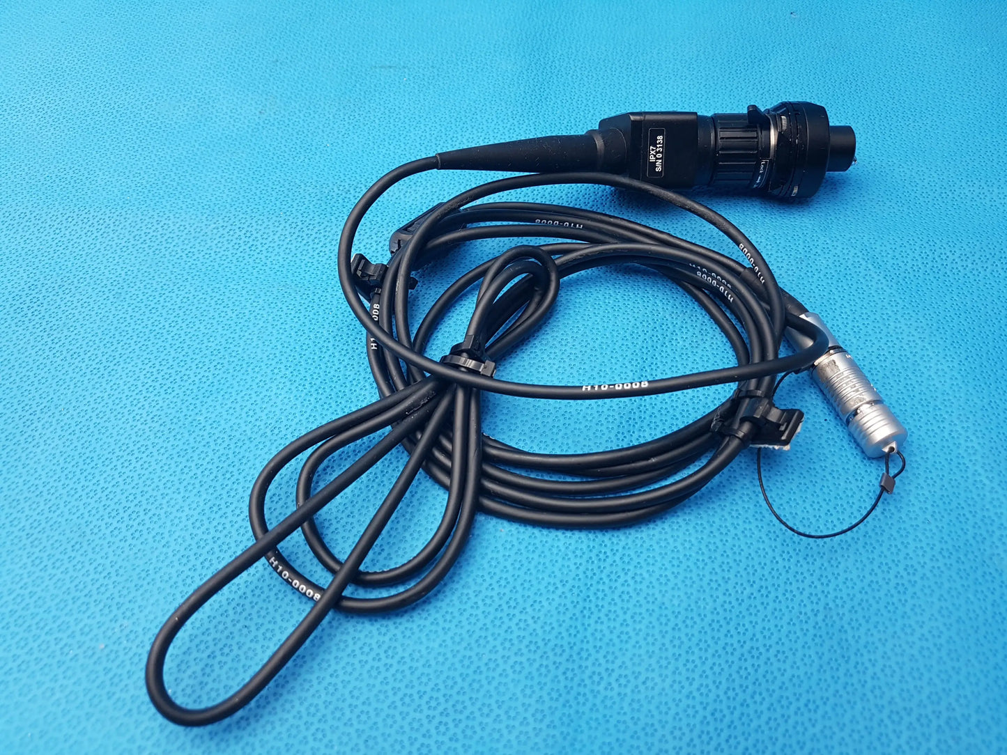 Black H10-0008 IPX7 endoscopic camera head with silver metallic connector and coiled cable compatible endoscopic device