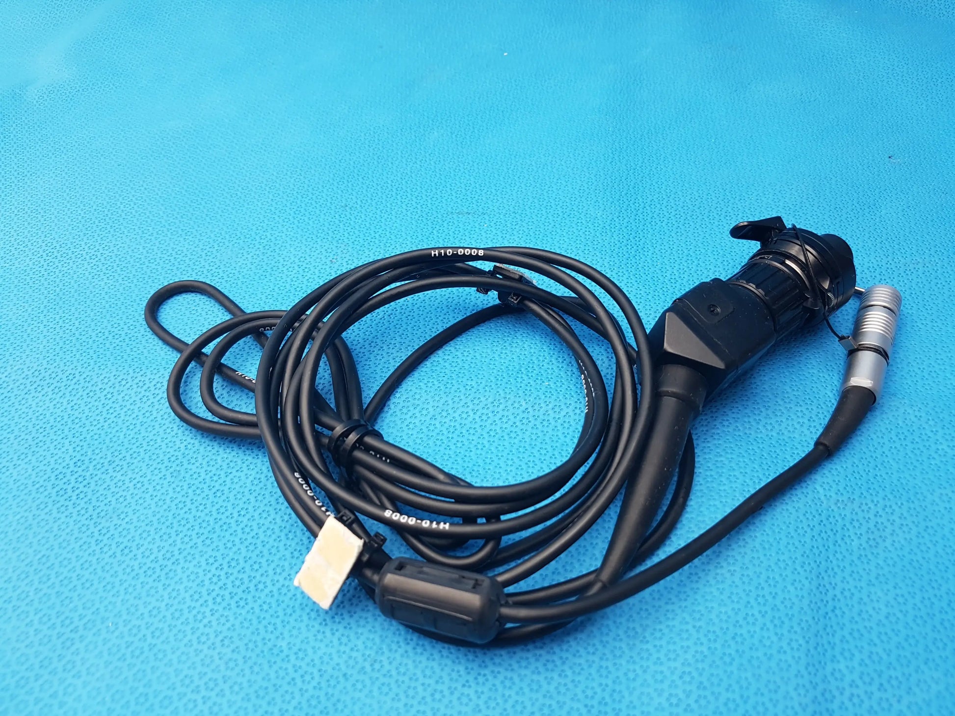 Black H10-0008 IPX7 endoscopic camera head with coiled cable and metallic connector compatible endoscopic device