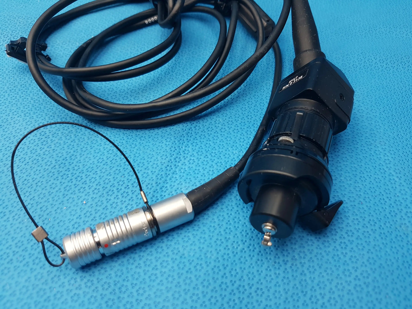 Black and silver H10-0008 ipx7 compatible endoscopic camera head with coiled cable and metallic connector