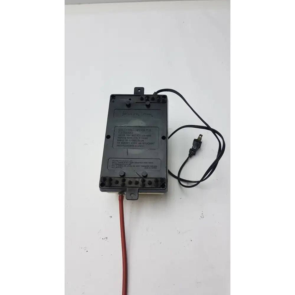 Black plastic hagen optima pump power adapter with red wire and printed 115 volt ac 60 hz 5 watts label