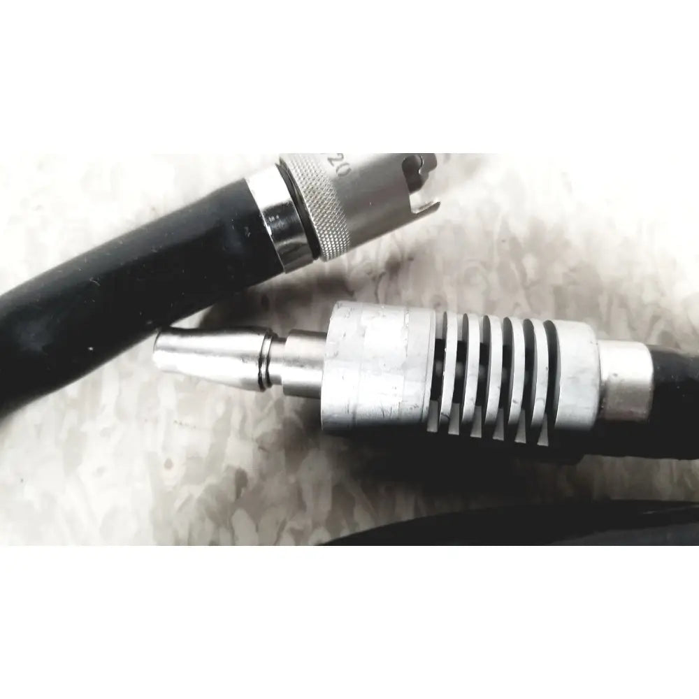Black and silver hall surgical micro dental handpiece with textured grip and ridged metallic body for precision use