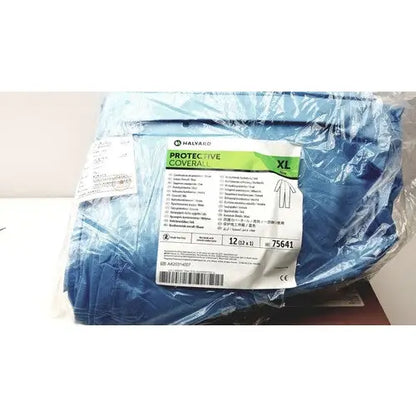 Blue medical protective coverall xl packaged in clear plastic with white and green label for protective coverall blue