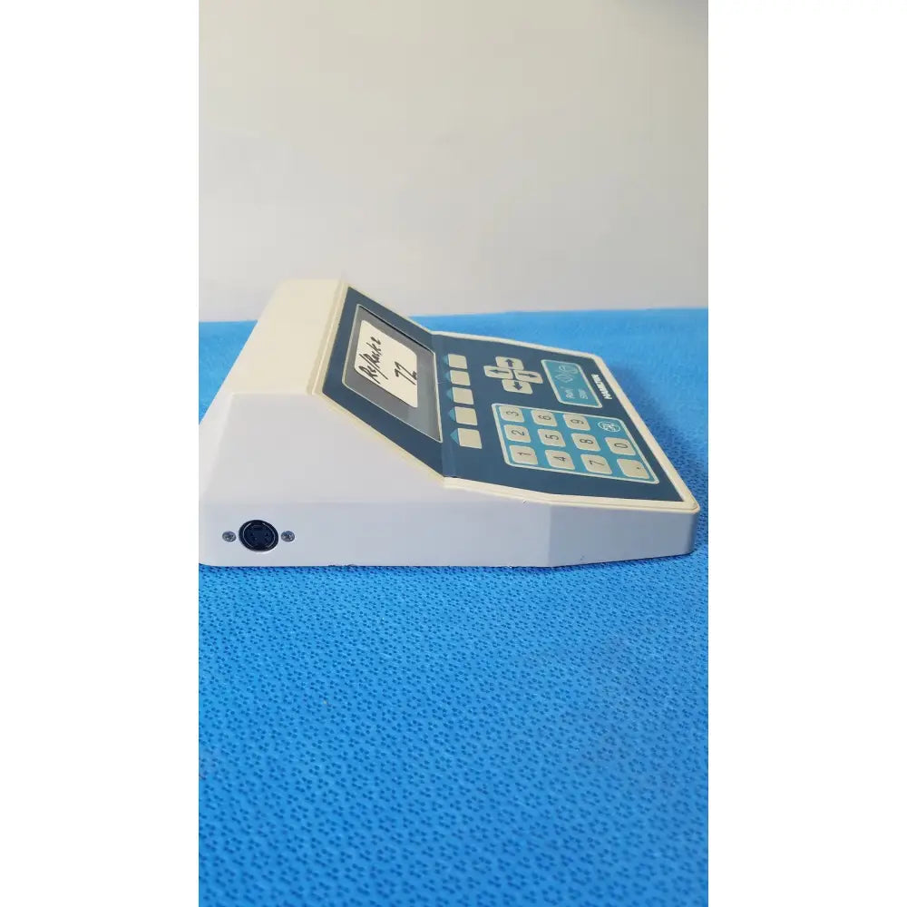 White plastic handheld hamilton 2373-01 keypad controller with dark blue panel for liquid handling and reuse medical use