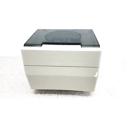 Beige two-tiered hamilton bell vanguard v6500 centrifuge with dark gray transparent lid and black trim for lab use