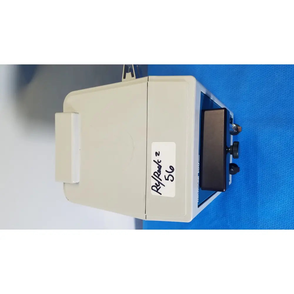Beige rectangular hamilton microlab series diluter dispenser with black display screen and two control knobs on the right side