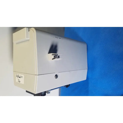 Beige and gray industrial-grade hamilton microlab 500 series diluter dispenser with wall-mounted handle for precise liquid handling