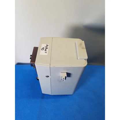 Beige plastic hamilton microlab 500 series syringe pump dispenser with a small white label on top left corner