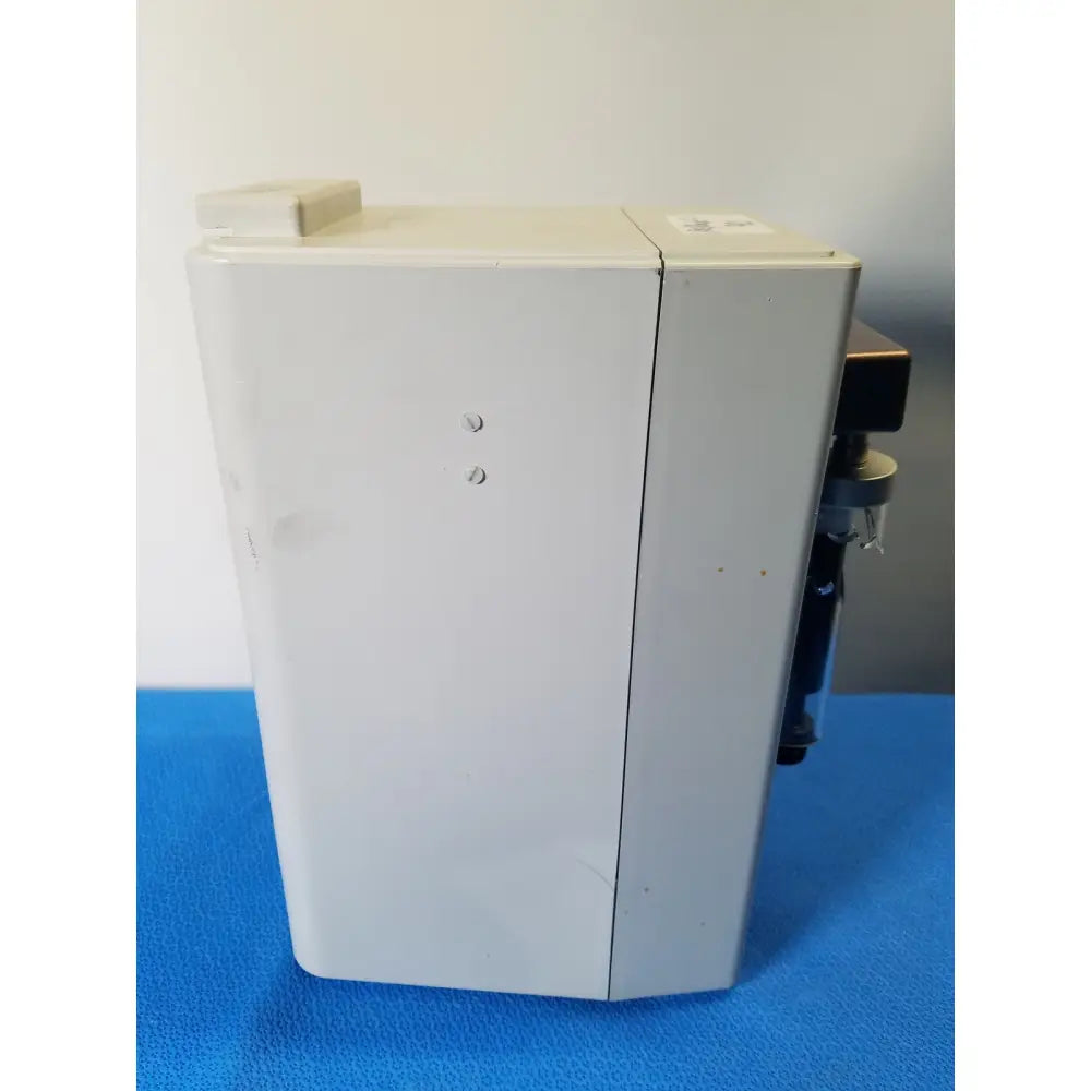 White rectangular hamilton microlab 500 series syringe pump dispenser with hinged lid and visible mechanical components