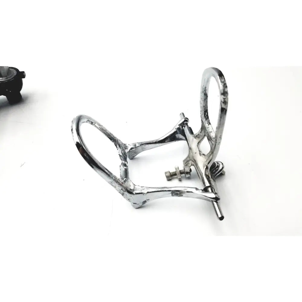 Silver-toned metal dental bite plate with polished finish and adjustable screws in hanau semi-adjustable dental chrome articulator