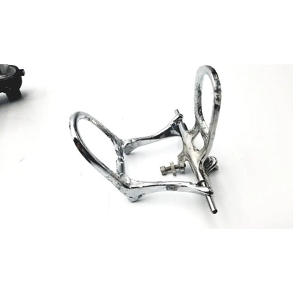 Silver-toned metal dental bite plate with polished finish and adjustable screws in hanau semi-adjustable dental chrome articulator