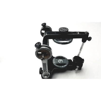 Hanau semi-adjustable dental modular chrome articulator with black metal body silver accents and engraved markings