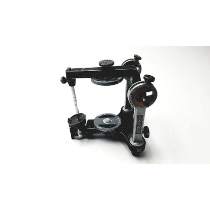 Hanau semi-adjustable dental modular with black and silver chrome articulator featuring adjustable arms and knobs