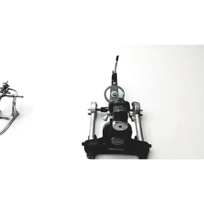 Black and silver metal drum pedal with circular footplate and adjustable lever for hanau semi-adjustable dental modular chrome articulator