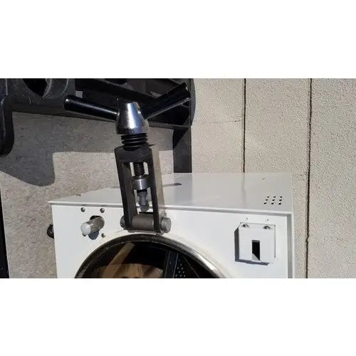 Black metal pipe wrench mounted on white harvey sterilemax st75935 appliance for reuse medical applications