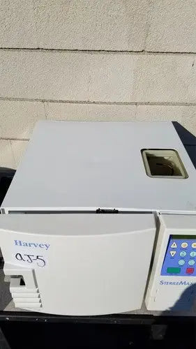 White plastic laboratory centrifuge harvey sterilemax st75935 with digital control panel labeled harvey qj5