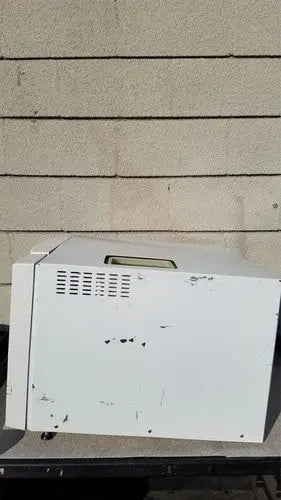 White slightly scratched harvey sterilemax st75935 printer with vented side panel and rectangular slot on top