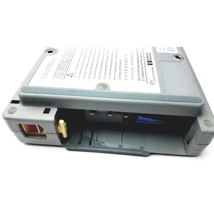 Gray plastic hp heartstream eo1 semi automatic defibrillator showing label and internal components for emergency use
