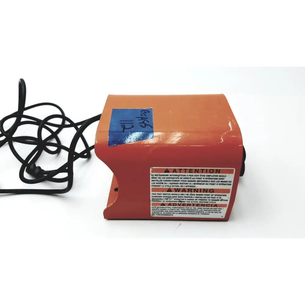 Orange heavy duty foot enclosure with clipper linemaster control switch and black cord featuring warning label
