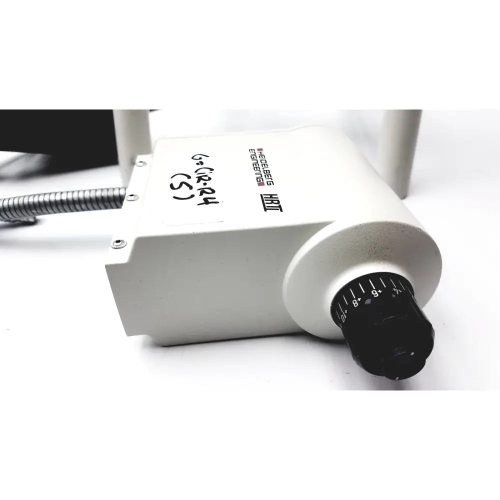 White rectangular medical device heidelberg engineering hrti laser head model lsc210 with black dial and silver tubing attached