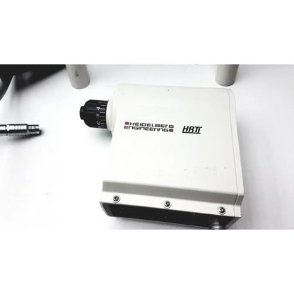 White rectangular microscope stage with black knurled focus knob and heidelberg engineering hrti branding for hrti laser head