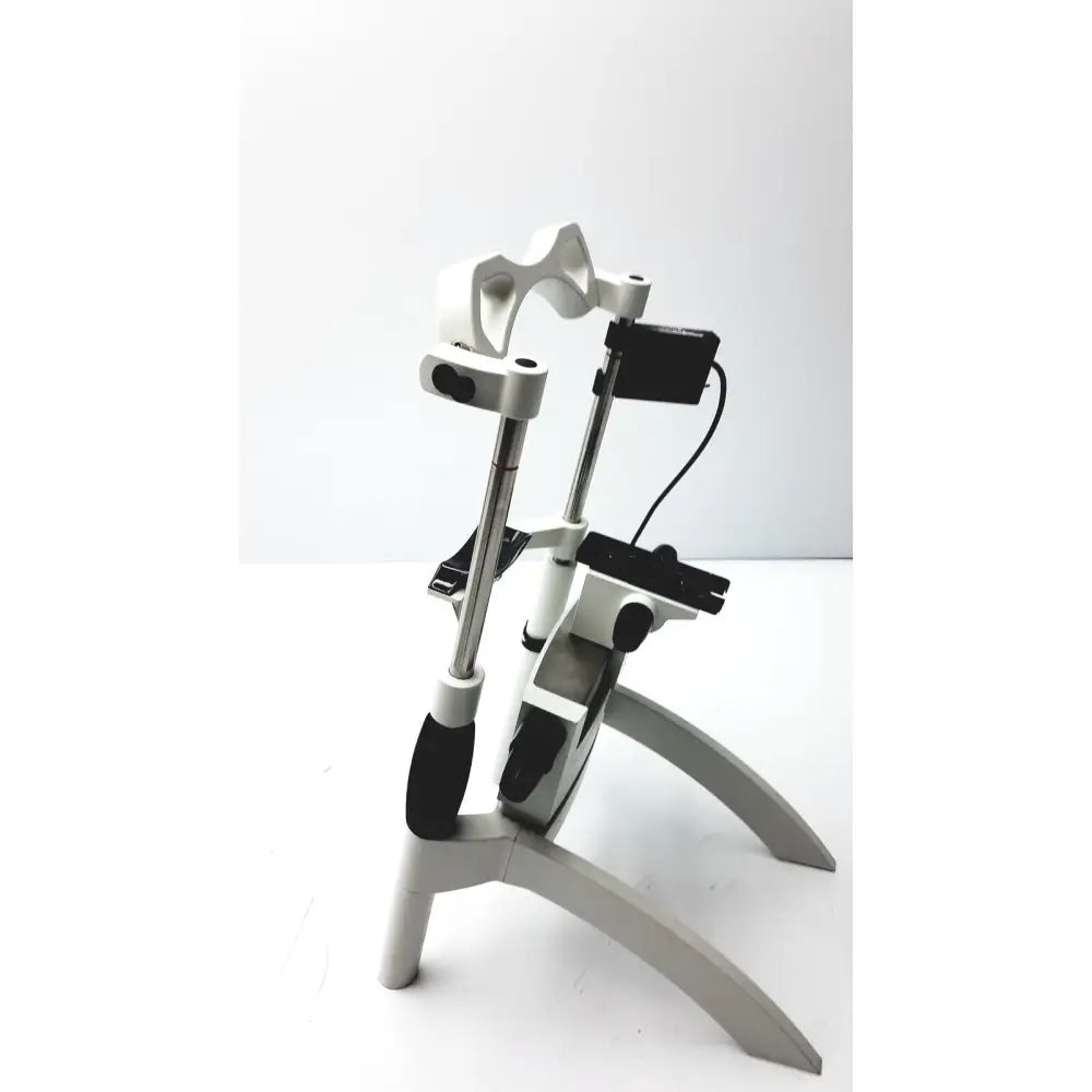 White and black adjustable bicycle stand with metallic poles and ergonomic grips for heidelberg engineering hrti laser head accessories