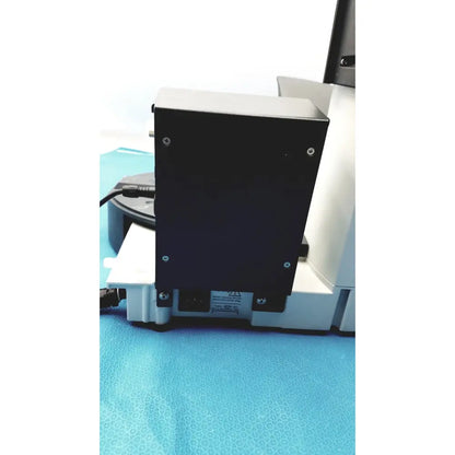 Black rectangular electronic device with silver screws and power input port on the back of heidolph basis hei-vap rotary evaporator