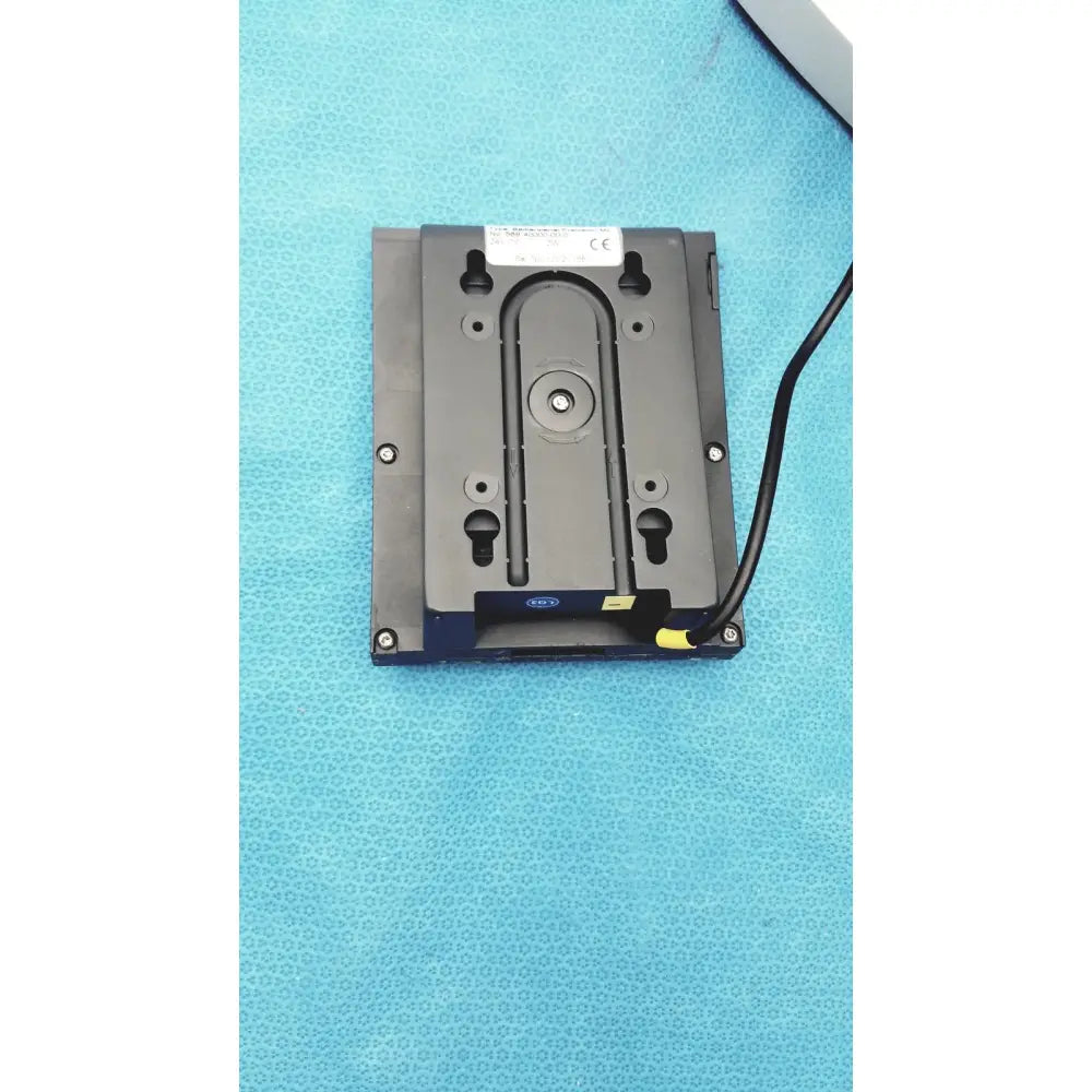 Black rectangular matte heidolph basis rotary evaporator back panel with mounting holes and yellow cable connector