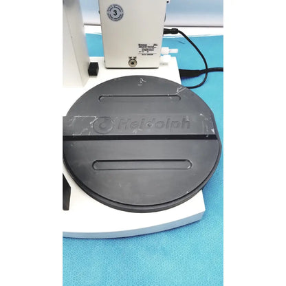 Black circular Heidolph Basis Hei-Vap rotary evaporator plate with embossed logo and two horizontal slots