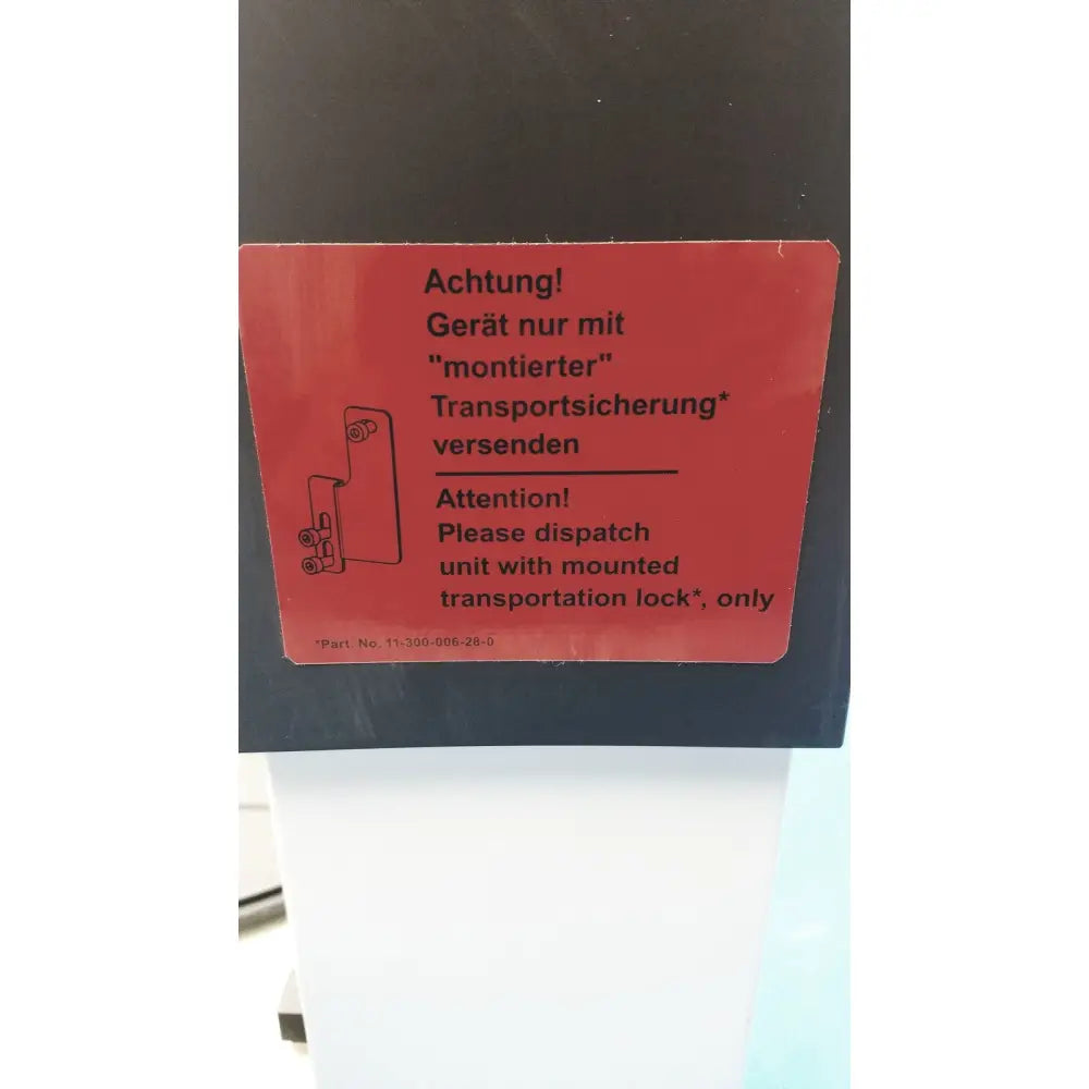 Red warning label on heidolph basis hei-vap ml rotary evaporator instructing dispatch only with mounted transport lock