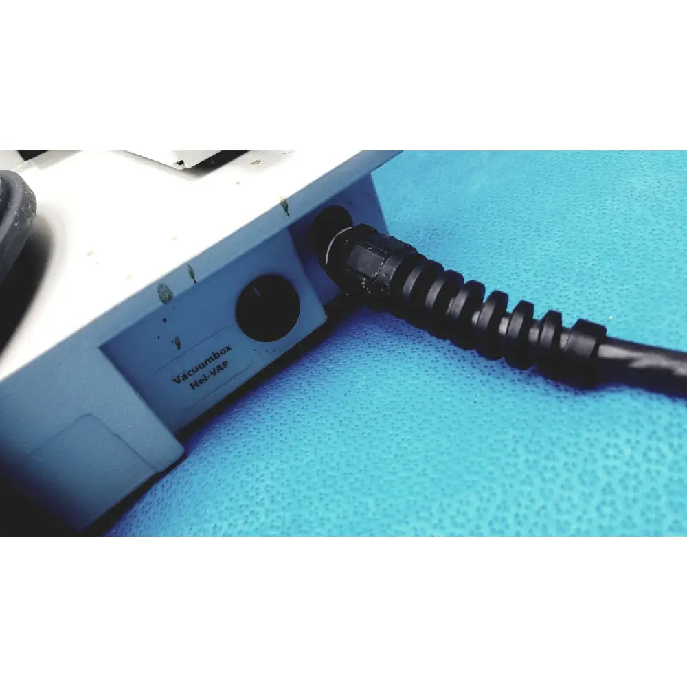 Black coiled cable with threaded connector plugged into light blue heidolph basis hei-vap rotary evaporator device