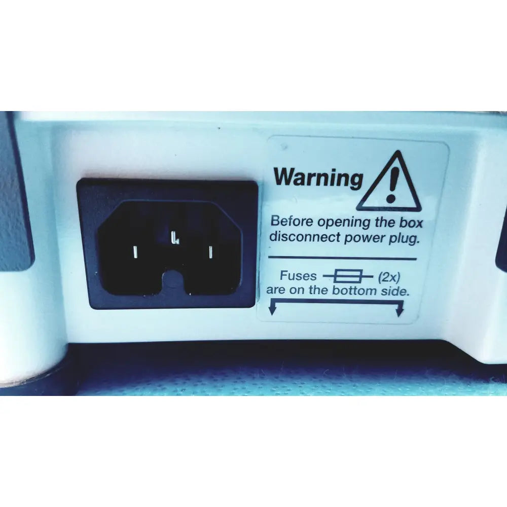 Black power plug set in white housing with warning label on the back of heidolph basis hei-vap rotary evaporator