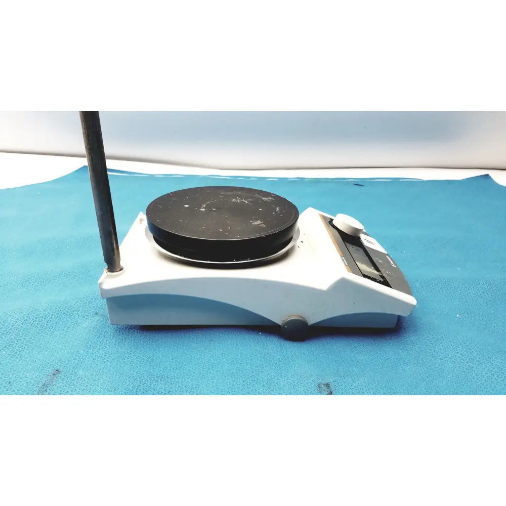 White and gray Heidolph MR Hei-Tec magnetic stirrer hotplates with black circular heating surface and pt1000 sensor