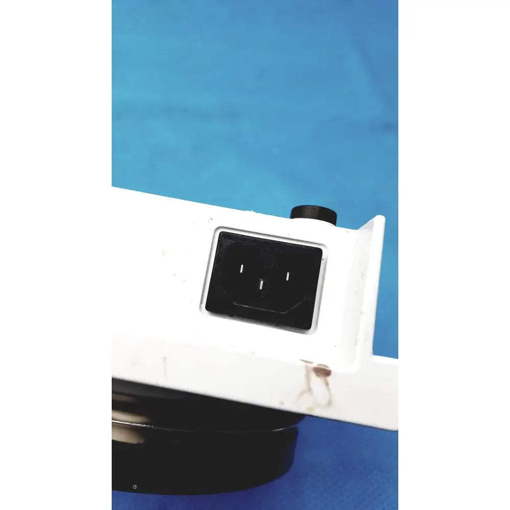 White plastic power input port with black socket and three prongs on back of Heidolph MR Hei-Tec magnetic stirrer hotplates PT1000