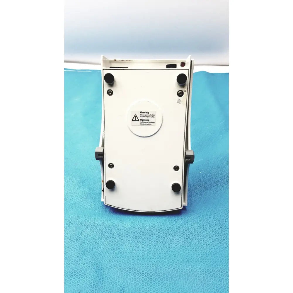 White plastic heidolph mr hei-tec magnetic stirrer hotplates with black rubber feet and circular warning label for pt1000 sensor