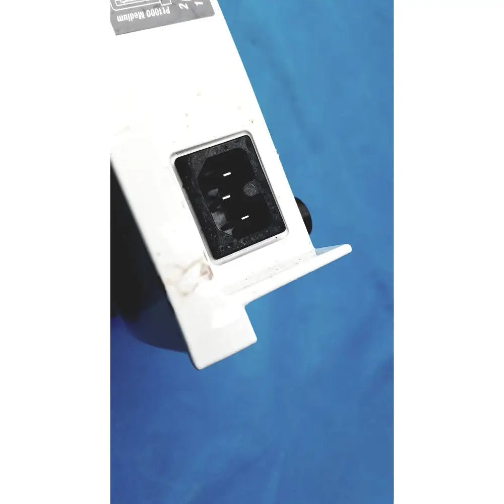 White plastic power adapter with black input port and wear on back of Heidolph MR Hei Tec magnetic stirrer hotplates pt1000