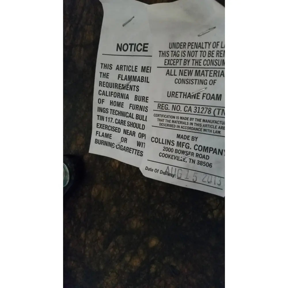 White paper safety label with black text and silver pins for urethane foam on height adjustable phlebotomy chair reg ca 31278