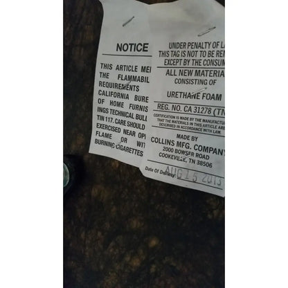 White paper safety label with black text and silver pins for urethane foam on height adjustable phlebotomy chair reg ca 31278
