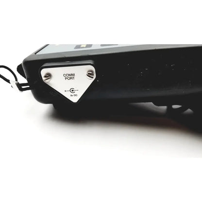 Black hand held calibrator with white comm port panel and 9v dc label heise calibrator 6d49 e171189 back side