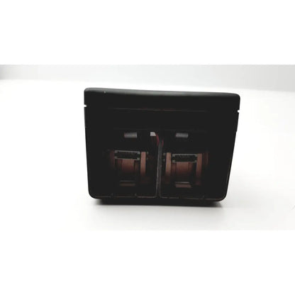 Black rectangular hand held calibrator 6d49 e171189 with two internal compartments housing reddish-brown cylinders