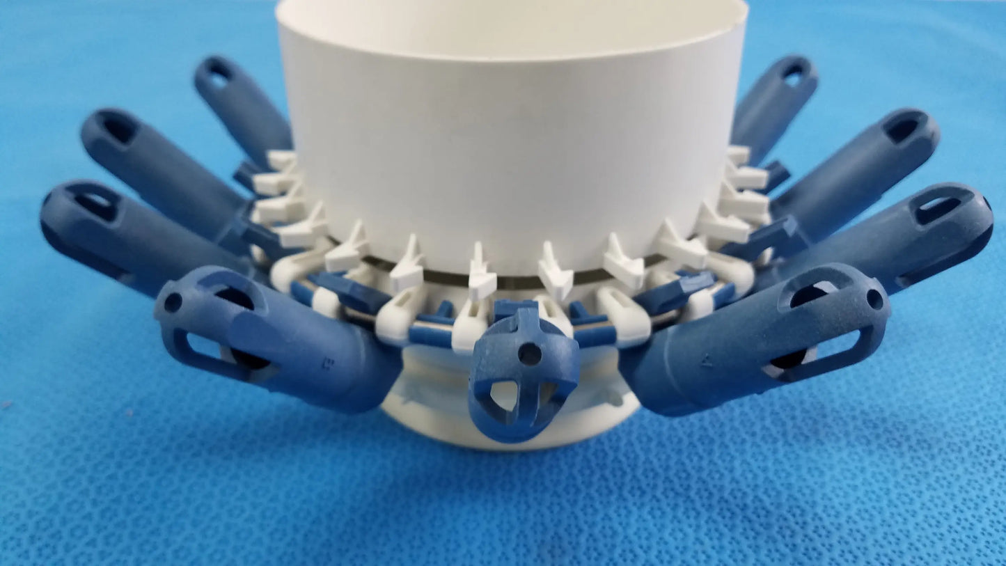 Blue and white plastic clothes drying rack with multiple arms shown alongside helmer centrifuge rotor with tube inserts