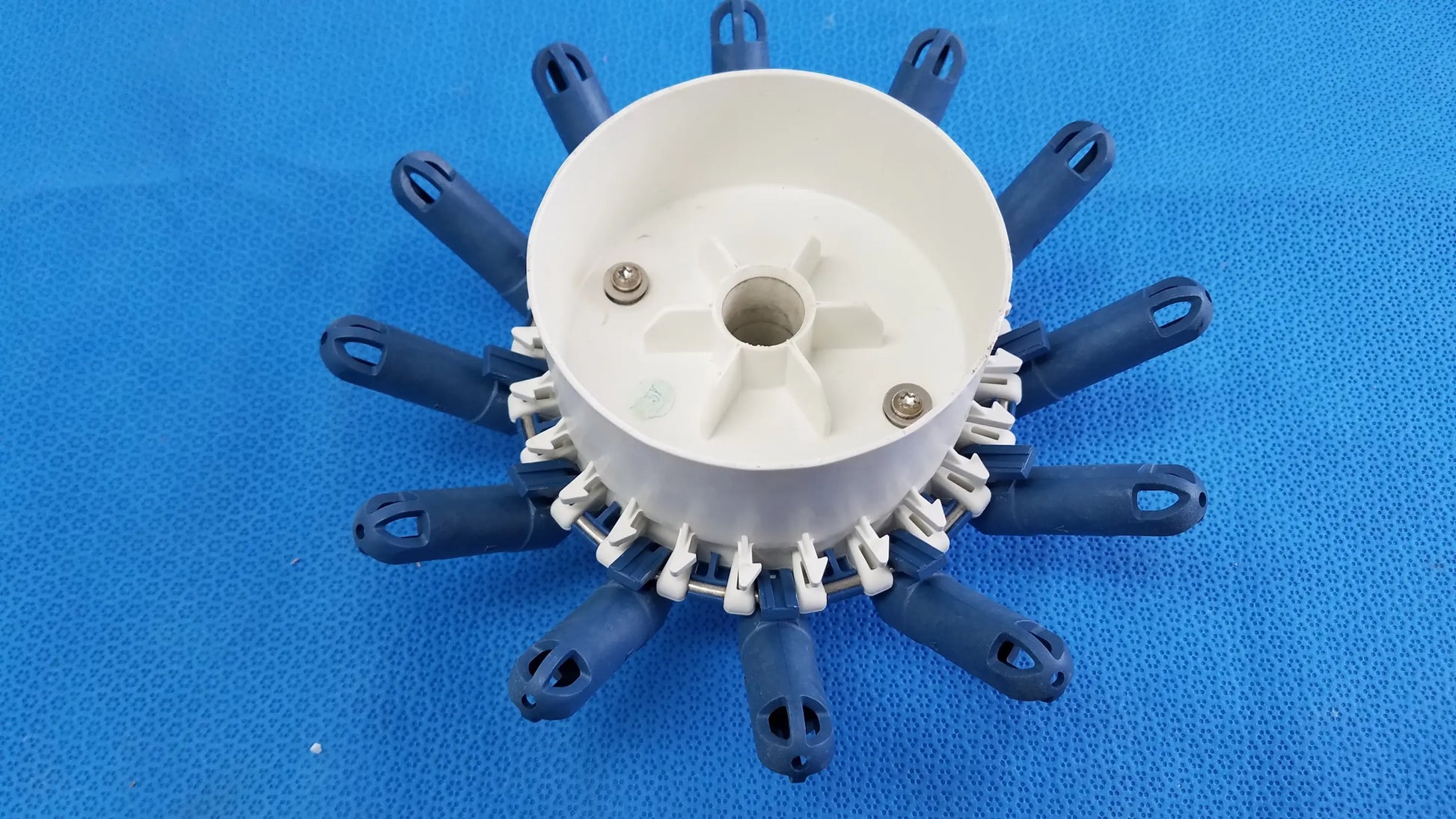 White and blue plastic centrifuge rotor with twelve tube inserts compatible with helmer centrifuge 450001-C model