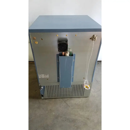 Back view of gray industrial-grade metal helmer hlf105 horizon series laboratory freezer with black fan and copper tubing