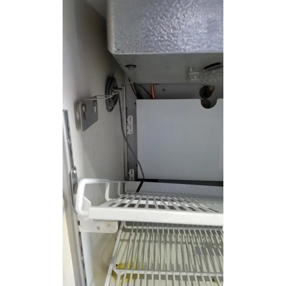 White plastic wire rack with grid pattern inside helmer hlf105 horizon series laboratory freezer compartment