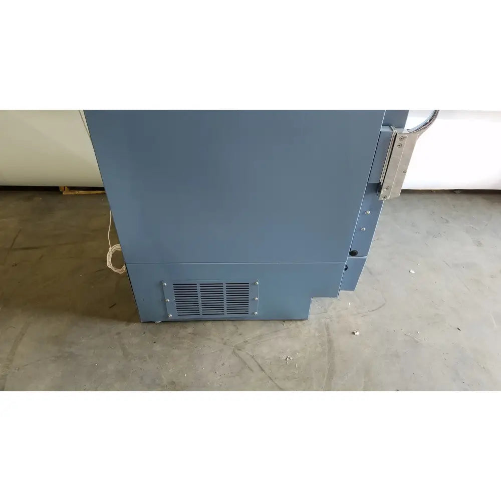 Gray industrial-grade helmer hlf105 horizon series laboratory freezer with metal hinge and vent grille visible