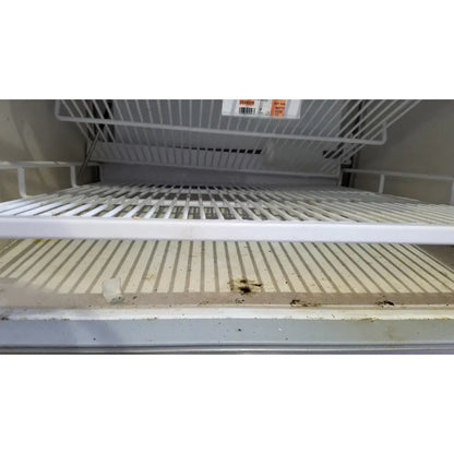 White plastic refrigerator shelf with vertical slats and dirt stains in helmer hlf105 horizon series laboratory freezer