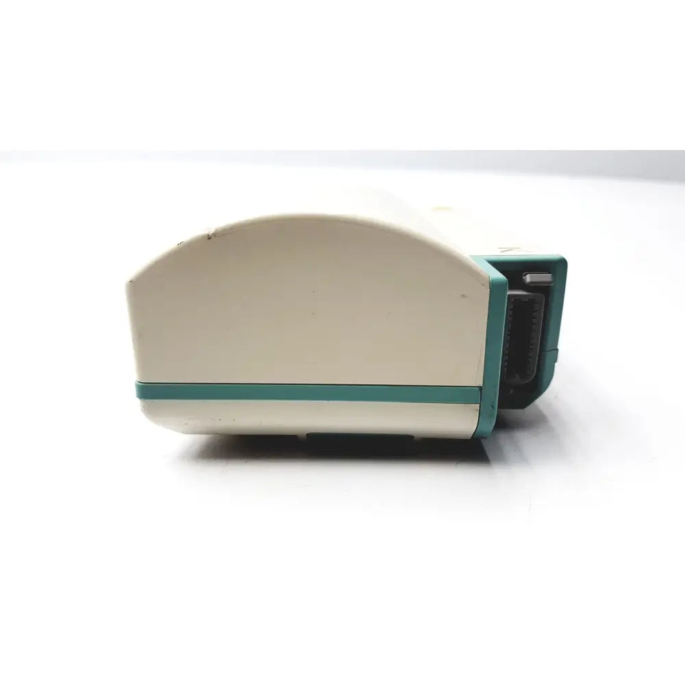 Cream-colored and teal plastic hewlett packard speed point technology m3000a with curved top and rectangular connector port
