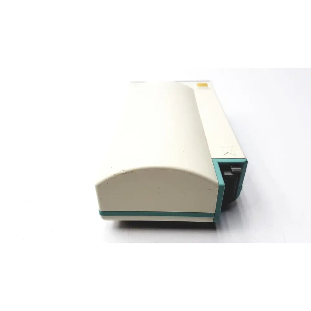 Cream-colored plastic medical device with teal accents and black component by hewlett packard speed point technology m3000a