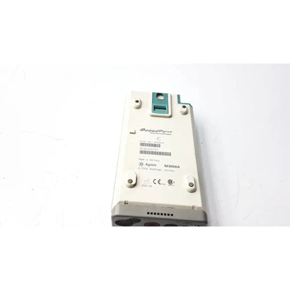White rectangular hewlett packard speed point technology m3000a with teal connector made in germany electronic device